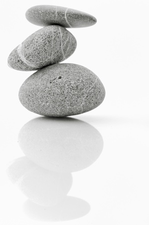 Pyramid of stones over white.の写真素材