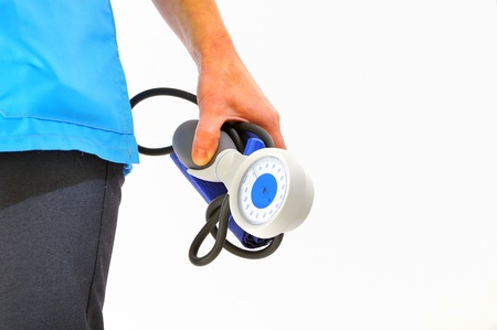 Female doctor holding a blood pressure cuff 