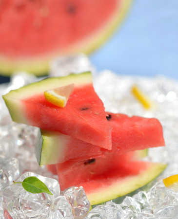 Watermelon slices and ice on blue , macroの写真素材