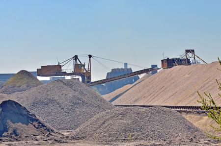 Heavy excavator loader at soil moving works at quarryの写真素材