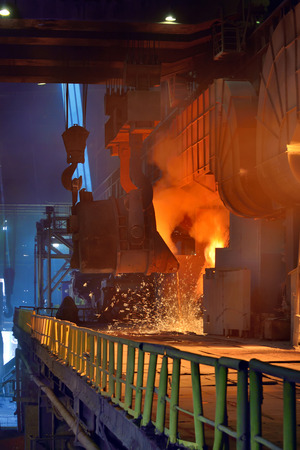 Pouring of liquid metal in open hearth workshopの写真素材
