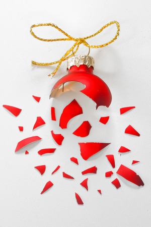 Broken Red Christmas tree ball isolatedの写真素材