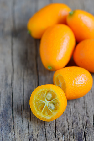 Detail of Kumquat on wooden backgroundの写真素材