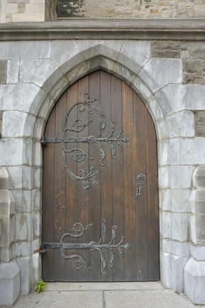 old wooden door with iron ornaments in Dublinの写真素材