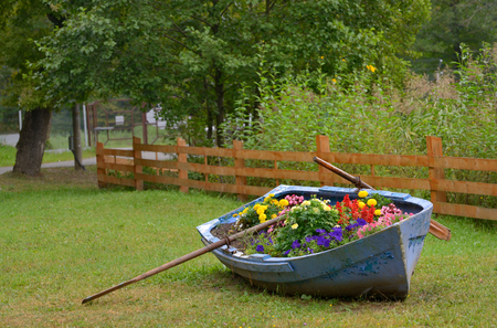 Boat decoration with flowers in parkの写真素材