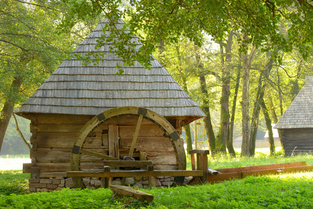 Old vintage water mill in autumn timeの写真素材