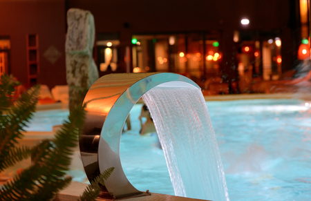 Relaxation pool in spa with waterfallの写真素材