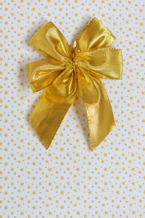 Gold ribbon with bow and starsの写真素材