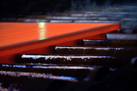 Hot steel plate on conveyorの写真素材