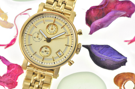 Woman gold wrist watch isolatedの写真素材