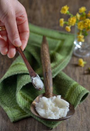 coconut oil on the wooden spoonの写真素材