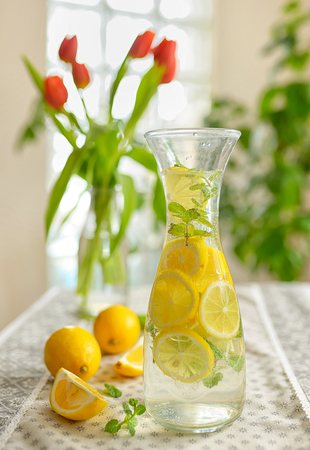 Fresh limes and lemonade on tableの写真素材