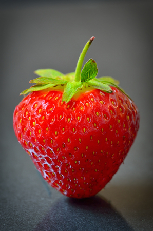 Strawberry fruit isolated on black  backgroundの写真素材