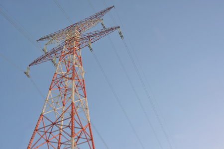 High voltage post and clear blue skyの写真素材