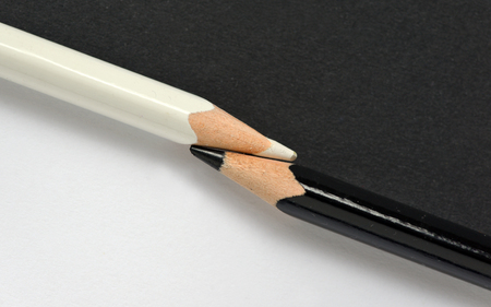 abstract black and white crayons on the same paper backgroundの写真素材