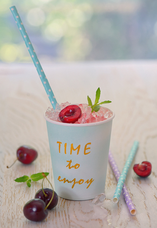 cherry syrup with ice in summer timeの写真素材