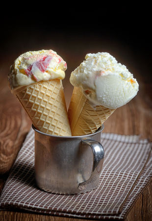 Two ice cream cones in mugの写真素材
