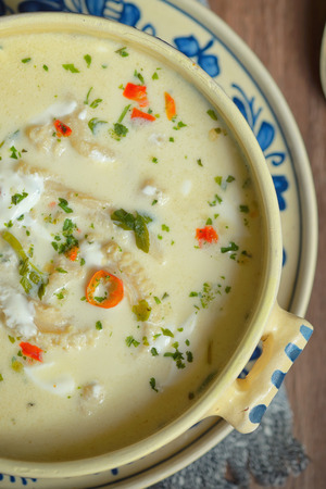 Traditional tripe soup on wooden tableの写真素材