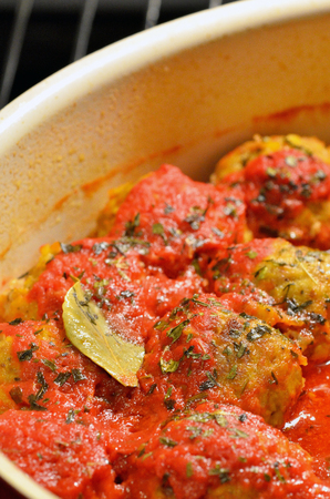 Meat balls with tomatoes sauce in ovenの写真素材