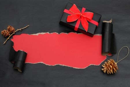 Top View Of Black Torn Paper And A Giftの写真素材