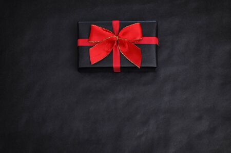 Top View Of Black Paper And A Giftの写真素材