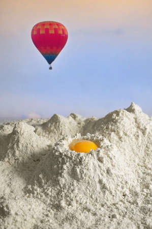 Conceptual Yolk Egg On  Flour Like Mountainsの写真素材