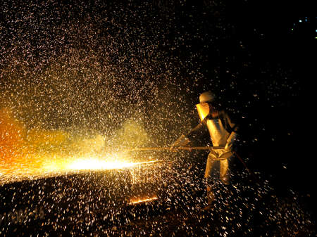 Industrial welder worker in steel plantの写真素材