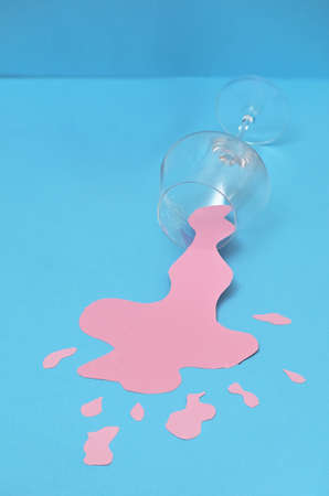 Abstract Overturned Glass Of Spilled Rose Wineの写真素材