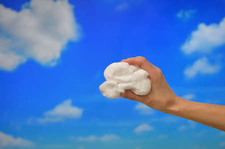 Concept Hand hold Clouds from Cotton woolの写真素材