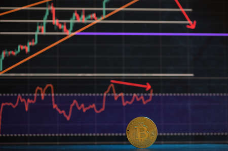 Galati, Romania - April 24, 2021 Studio shot of golden Bitcoin currency With Growth Chartの写真素材