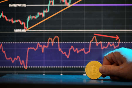 Galati, Romania - April 24, 2021 Studio shot of golden Bitcoin currency With Growth Chartの写真素材