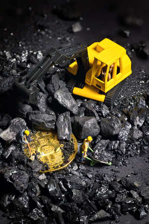 Construction site with miniature workers cryptocurrency mining Bitcoinの写真素材