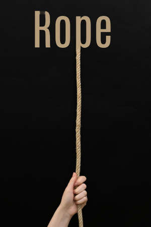 Conceptual Female Teen Hanging Ropeの写真素材