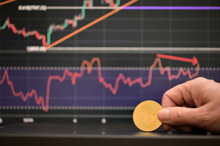 Galati, Romania - April 24, 2021 Studio shot of golden Bitcoin currency With Growth Chartの写真素材