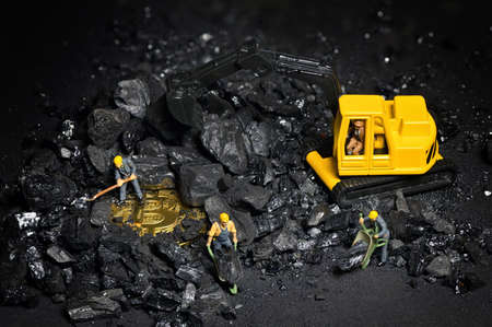 Galati, Romania - April 27, 2021 Construction site with miniature workers cryptocurrency mining Bitcoinの写真素材