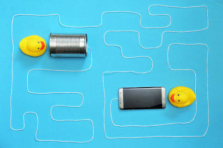 Communication Tin Can Phone With String and Smartphone and Toy Ducks