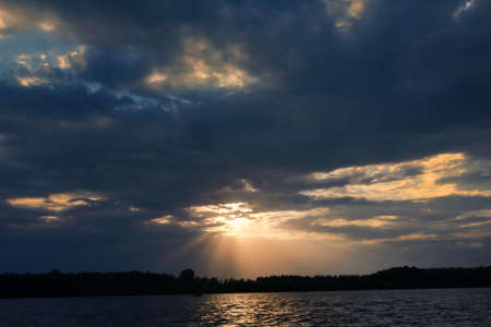 Dramatic sunset over Danube River Romania in summerの写真素材