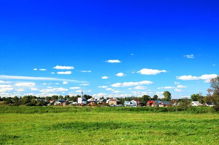 russia village rural landscape with blue sky and cloudの写真素材