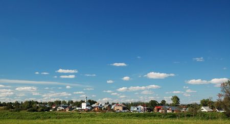russia village rural landscape with blue sky and cloudの写真素材