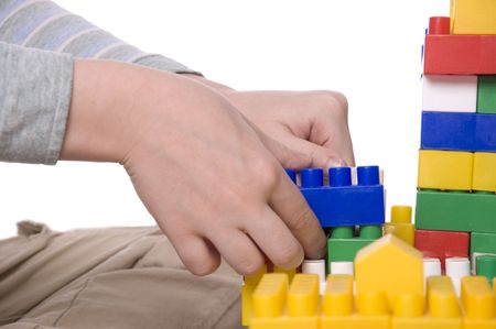 The child the boy plays on white background hand macroの写真素材