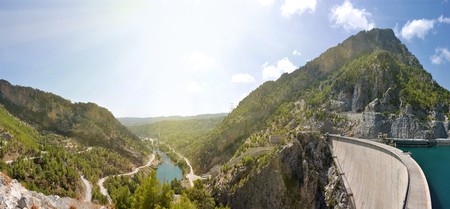 mountain canyon and hydroelectric dam panorama under skyの写真素材