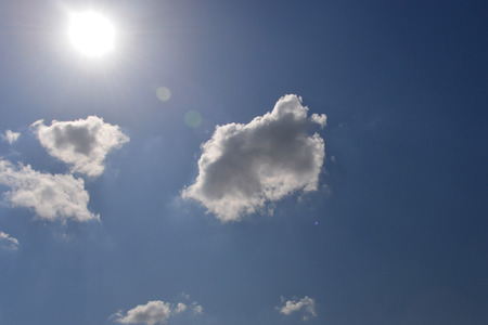 Blue sky and cloud with bright sun star flare background