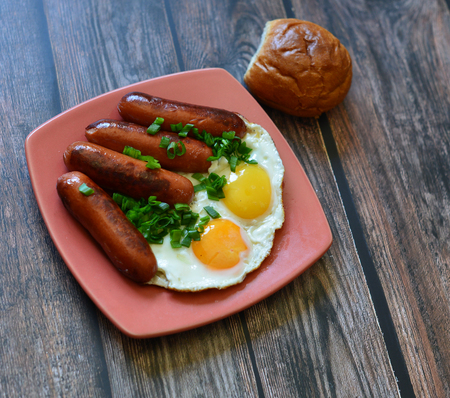 american breakfast with egg sausage bread vegetableの写真素材