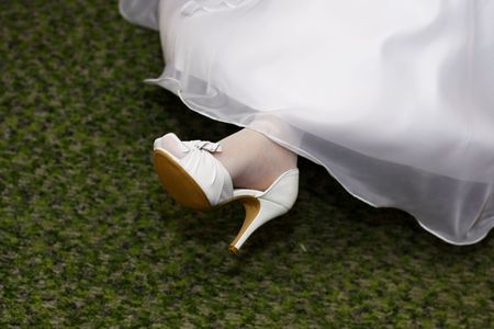 Bride with wedding dress and white shoesの写真素材