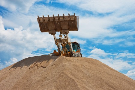 Yellow bulldozer at construction siteの写真素材