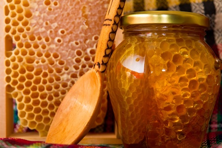 Jars of honey and honeycombの写真素材