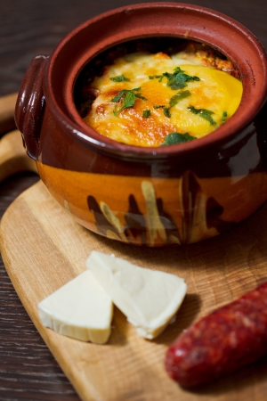 Stew pot with sausage and cheeseの写真素材