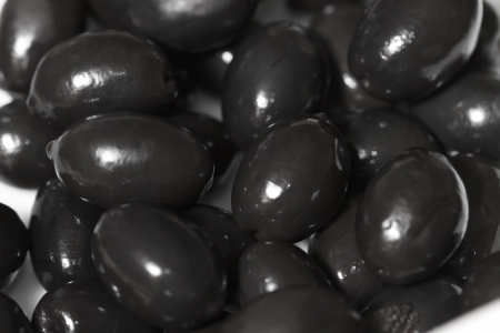 Fresh raw olives with shiny oilの写真素材