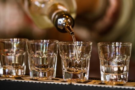 Barman make alcoholic shots in nightclubの写真素材