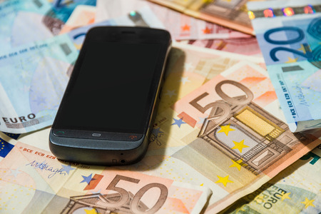 Phone on money notesの写真素材